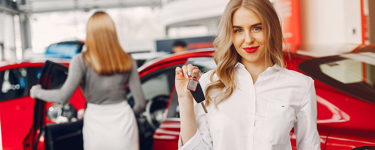 A white dress lady with a car key